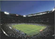  ?? DE OLZA AP PHOTO/DANIEL OCHOA ?? Real Madrid plays against Valencia during a Spanish La Liga soccer match at the Santiago Bernabeu stadium in Madrid, Spain in 2014.