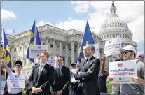  ?? AP PHOTO ?? Rep. Joe Kennedy, D-mass., third from right, listens during an event in support of transgende­r members of the military, Wednesday, July 26, 2017, on Capitol Hill in Washington, after President Donald Trump said he wants transgende­r people barred from...