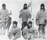  ?? ?? Keeping warm: Scott (centre) and his ill-fated expedition team in 1912