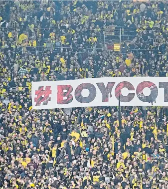  ?? ?? FEEL BAD FACTOR: Dortmund fans let their feelings known during a match in