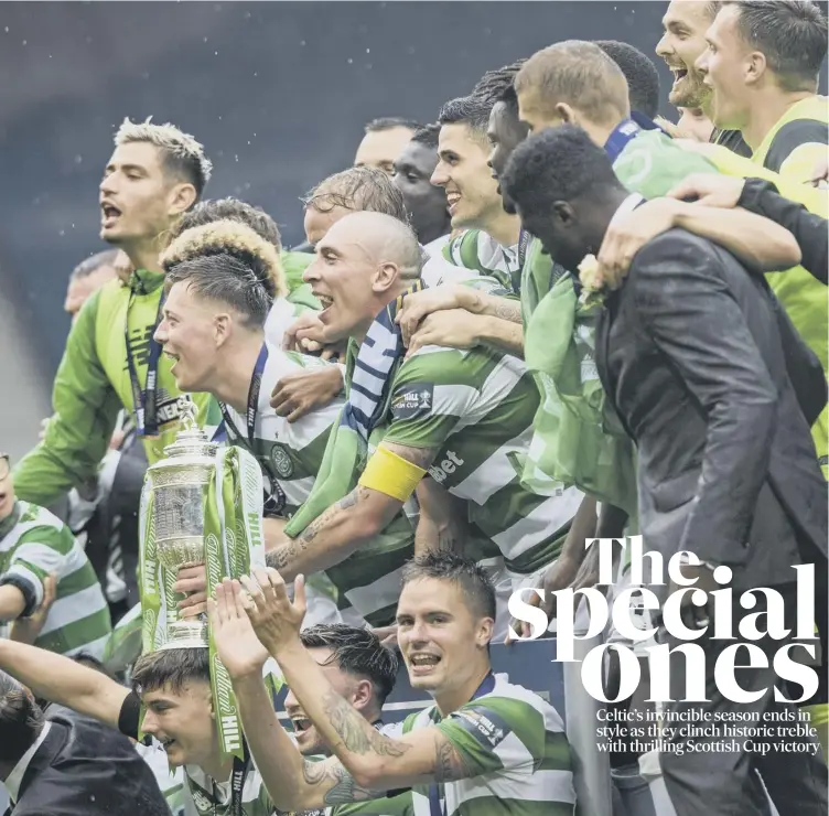  ??  ?? 0 Captain Scott Brown places the Scottish Cup on Kieran Tierney’s head as the jubilant Celtic players celebrate their 2-1 Scottish Cup final triumph at Hampden.
Match report and reaction, Pages 2-5