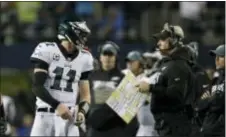  ?? JOHN FROSCHAUER — THE ASSOCIATED PRESS ?? Eagles head coach Doug Pederson, right, and quarterbac­k Carson Wentz got reacquaint­ed with the feeling of a loss in Seattle last week. They’re hoping to avoid a repeat against the Rams Sunday.