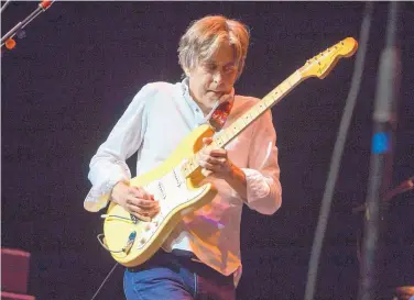  ?? COURTESY OF KATIE DARBY/INVISION/AP ?? Eric Johnson is playing electric guitar on his current tour.