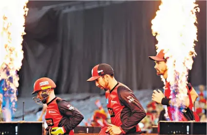  ??  ?? Feel the heat: Renegades players emerge to take on Brisbane at Melbourne’s Etihad Stadium in the Big Bash League