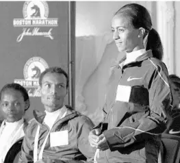  ?? BILL SIKES/ASSOCIATED PRESS ?? Ethiopia’s Buzunesh Deba, right, was given the 2014 Boston Marathon title after Rita Jeptoo was disqualifi­ed for doping but missed out on the benefits of being a race winner.