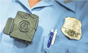  ?? AFP/GETTY IMAGES ?? The Clermont County Board of Commission­ers, which manages the sheriff’s budget with his input, is not ruling out the possibilit­y of equipping deputies with body cameras in the future.