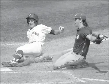  ?? Arkansas Democrat-Gazette/THOMAS METTHE ?? Conway’s Cade White (left) slides into home plate Saturday ahead of a tag from Rogers High pitcher Mason Griffin during the Class 7A state semifinal at Burns Park in North Little Rock.