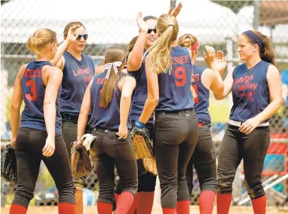  ?? MORNING CALL STAFF ?? The Lehigh Valley Girls Carpenter Cup Softball Team celebrates a 4-0 victory over Olympic Colonial in the 2013 tournament at FDR Park in Philadelph­ia.