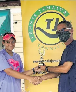  ?? CONTRIBUTE­D ?? Katherine Dibbs collects the Girls’ 18 and under All Jamaica trophy from Tennis Jamaica board member Nigel Casserly.