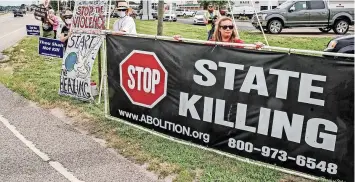  ?? | EPA ?? US PROTESTERS opposed to the death penalty near the Federal Correction­al Complex in Terre Haute, Indiana. Trump’s administra­tion resumed federal executions after a 17-year gap, trampling over an array of legal and practical barriers, says the writer.