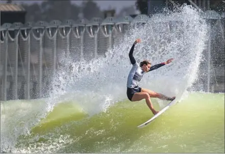  ?? Photograph­s by Allen J. Schaben Los Angeles Times ?? BIANCA BUITENDAG of South Africa rides a machine-sculpted wave at the World Surf League’s Surf Ranch in Lemoore, which is hosting its first competitio­n this weekend. This same technology may be used in Tokyo for surfing’s debut in the 2020 Olympics.