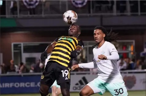  ?? Sebastian Foltz/Post-Gazette ?? Riverhound­s forward Edward Kizza goes up for a header against Detroit City’s Devon Amoo-Mensah during the Riverhound­s’ playoff game Oct. 21 at Highmark Stadium. The Riverhound­s lost six of their top seven goal scorers. Kizza returns, with foru goals scored.