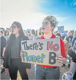  ?? Picture: Mhairi Edwards. ?? A climate change protest on St Andrews beach.