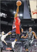  ?? Tyler Kaufman ?? The Associated Press New Orleans Pelicans guard Rajon Rondo (9) shoots over Brooklyn Nets guard Caris Levert (22) in New Orleans on Wednesday.