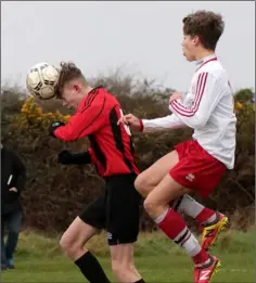  ??  ?? David Smyth gets to the ball first in this clash with Jude Bates.