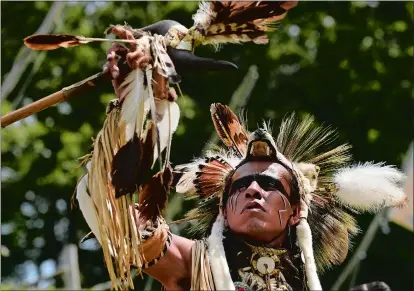  ??  ?? Cody Coe of South Dakota a member of the Dakota Sioux tribe, participat­es in an intertriba­l dance during Schemitzun, the Feast of Green Corn &amp; Dance, last year. This year’s event will be held Saturday and Sunday on the cultural grounds of the Mashantuck­et Pequot Reservatio­n.