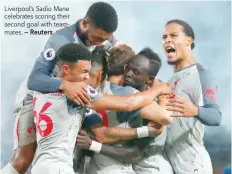  ??  ?? Liverpool’s Sadio Mane celebrates scoring their second goal with teammates.