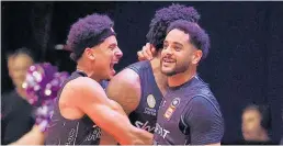  ?? Photo / Getty Images ?? The Webster brothers enjoy the win with Breakers team-mate Levi Randolph, who made the winning shot.