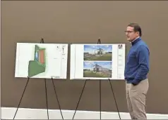  ?? Blake silvers ?? Lincoln Property Company representa­tive Denton Shamburger shows his company’s plans for a 400,000-square-foot spec warehousin­g facility on Belwood Road during an annexation and zoning hearing before the city council.