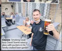  ??  ?? Cheers Smoking Goat boss David Storrie raises a glass with punters in his newly created beer garden