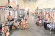  ?? AFP ?? Beggars in Hyderabad take shelter inside a temporary rehabilita­tion centre, where they were shifted after the police’s ban order.