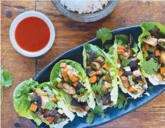  ?? LYNDA BALSLEV-TASTEFOOD ?? Miso mushroom lettuce wraps.