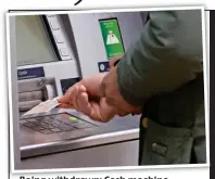  ??  ?? Being withdrawn: Cash machine