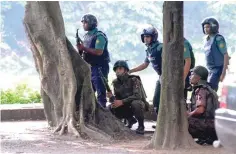  ?? — Reuters ?? File picture shows army soldiers take up positions near the Holey Artisan restaurant after militants attacked the upscale cafe in Dhaka, Bangladesh.