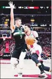  ?? ?? Chicago Bulls guard Zach LaVine (right), drives against Milwaukee Bucks guard Grayson Allen. (AP)