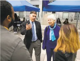  ?? Mason Trinca / Special to The Chronicle ?? Interim Vice Chancellor Stephen Sutton and Chancellor Carol Christ talk with resident directors at UC Berkeley.