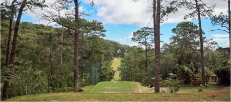  ?? PHOTOGRAPH BY RIO DELUVIO FOR THE DAILY TRIBUNE @tribunephl_rio ?? THE par-4 11th hole at the Baguio Country Club in Baguio City. A short 334-yard hole, it requires a tee shot into a narrow fairway below and an approach to an elevated green. It is the second hardest hole in the course.