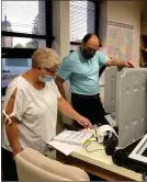  ?? PILOT NEWS GROUP PHOTO / JAMIE FLEURY ?? Marshall County Election Board member Sean Surrisi tests voting machines with Voter Registrati­on Deputy Melinda Keilman.