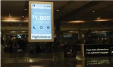  ?? ADRIENNE SIMIC ?? Flight Claim’s ads in the Montreal airport, prior to cancellati­on on Friday. “It did not meet our criteria for advertisin­g at the airport,” the airport said.