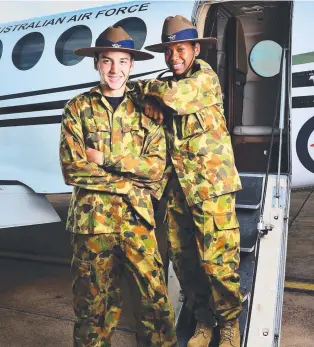  ??  ?? PLANE PROUD: Weipa air force cadets Donald Tyson, 15, and Charlotte Millett, 14, in Townsville for training at the RAAF base. Picture: ZAK SIMMONDS