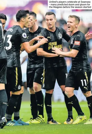  ??  ?? United’s players celebrate at Swansea – many predicted doom and gloom for the Magpies before the season started