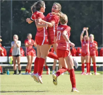  ?? STAFF PHOTO BY PATRICK MACCOON ?? Baylor soccer players celebrate a goal scored by Emery Carico, left, in Saturday’s 4-0 TSSAA Division II-AA state quarterfin­al win over visiting Lipscomb Academy.