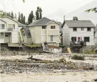  ?? JOHN GIBSON ?? Houses along Cougar Creek show extensive damage after the heavy flooding of 2013 in Canmore.