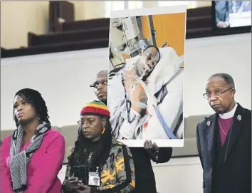  ?? Gerald Herbert Associated Press ?? FAMILY MEMBERS and supporters show a photo of Tyre Nichols at a news conference in Memphis, Tenn., on Monday. The California native was beaten by police on Jan. 7 during a traffic stop and died three days later.