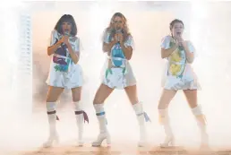  ?? UNIVERSAL PICTURES ?? In “Here We Go Again” flashbacks, Tanya, Donna and Rosie (Jessica Keenan Wynn, Lily James and Alexa Davies) rock to ABBA the first time around.