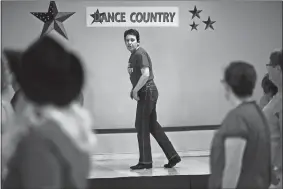  ?? DANA JENSEN/THE DAY ?? Co-owner Lisa Mazzaro, center, leads a line dancing class Wednesday at her new Dance Country business located in Gales Ferry. The studio opened Saturday.