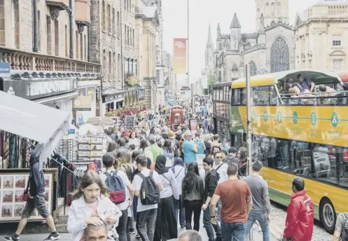  ??  ?? 0 Fears about ‘overtouris­m’ have lef Edinburgh’s touriosm chiefs to change their strategy from ‘driving growth to managing growth’