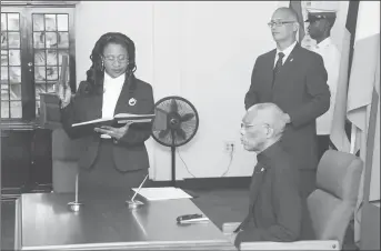  ??  ?? Justice Yonette Cummings-Edwards takes the oath of office