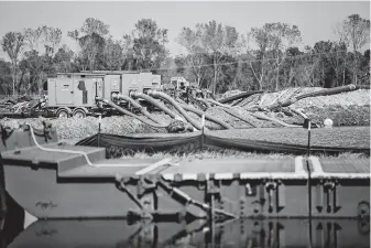  ?? Tamir Kalifa / New York Times ?? Pumps are used to keep a coal ash pit from flooding in the aftermath of Hurricane Florence in Conway, S.C., last year.