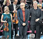  ??  ?? Taking a bow: Violinist Alina Ibragimov, composer Rolf Wallin, centre, and conductor Edward Gardner were the Bergen Philharmon­ic stars