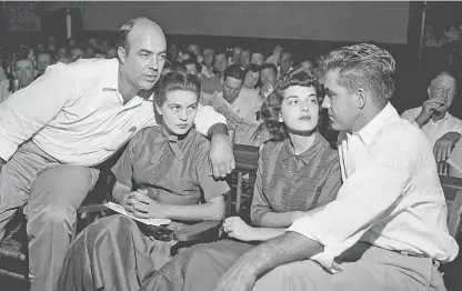  ?? AP ?? J.W. Milam (from left); his wife, Juanita; Carolyn Bryant, and Roy Bryant in a courtroom in Sumner, Miss., on Sept. 23, 1955. Experts say a newly found warrant from 1955 probably cannot lead to an arrest but could prompt a new look at the case.