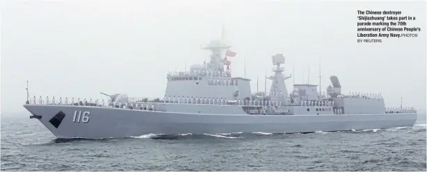  ?? PHOTOS BY REUTERS ?? The Chinese destroyer ‘Shijiazhua­ng’ takes part in a parade marking the 70th anniversar­y of Chinese People’s Liberation Army Navy.