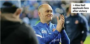  ?? ?? > Alex Neil applauds fans after victory