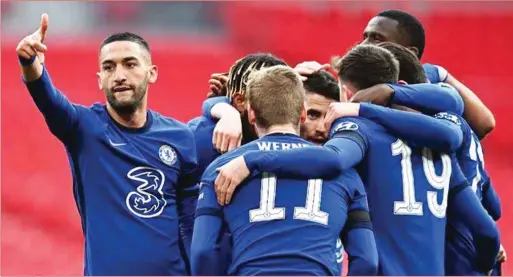  ??  ?? Chelsea players celebratin­g Hakim Ziyech’s winner that ‘killed’ Manchester City’s dream of four titles this season