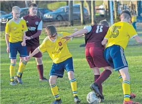  ??  ?? Ferry Athletic (yellow) beat Arbroath Lads 6-4 in an U/15 George Taylor League clash at Dawson Park.