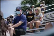  ?? GENE J. PUSKAR — THE ASSOCIATED PRESS ?? A limited number of socially distanced fans watch a spring training exhibition baseball game between the Pittsburgh Pirates and the Detroit Tigers at LECOM Park in Bradenton, Fla., on Friday.